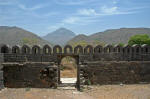 Girnar hill with its Jain and Hindu temples are on the hill in the middle.